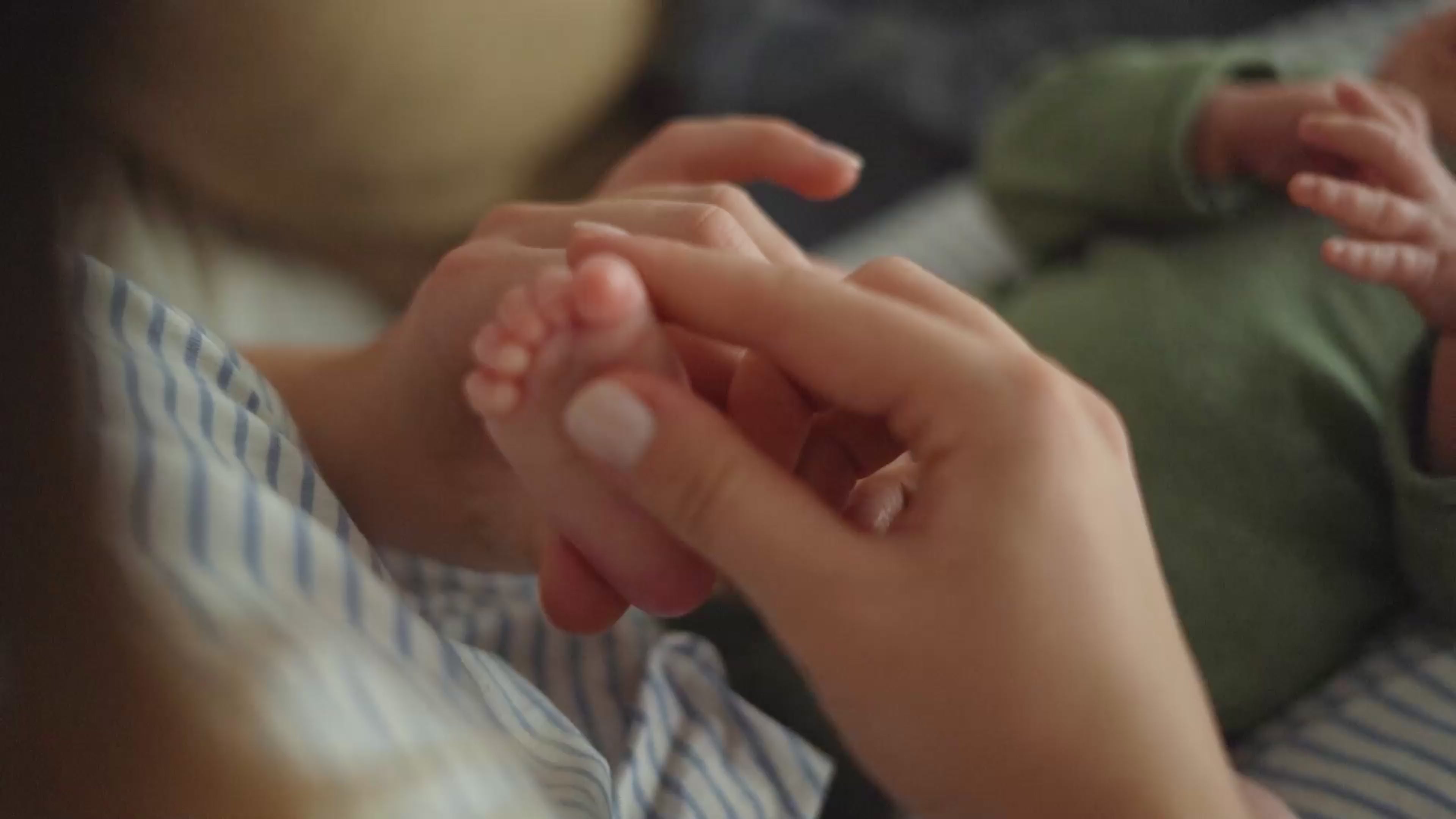 Load video: A caring mother gently caresses her baby’s tiny feet 💖